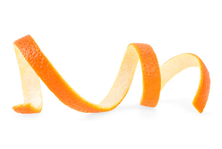 Orange peel or orange twist isolated on a white background. Citrus fruit. Orange zest spiral.の写真素材