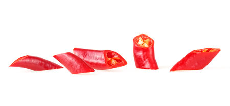 Front view of sliced red hot chili peppers isolated on a white background. Red chopped chili peppers.の写真素材