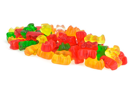 Jelly gummy bears isolated on a white background. Assortment of colorful and bright fruity flavor jelly bears candies.の写真素材