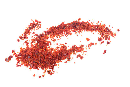 Dried red chili pepper flakes isolated on a white background. Red hot chilli pepper.の写真素材