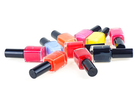 Bright multi-colored nail polishes isolated on a white backgroundの写真素材
