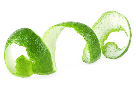 Peel of green citrus fruit isolated on a white background. Skin of fresh lime.の写真素材