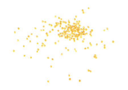 Dry yellow mustard seeds isolated on a white background, top view. Organic yellow mustard seeds.の写真素材
