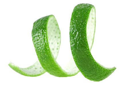 Curly lime peel twist. Lime fruit peel isolated on a white background.の写真素材