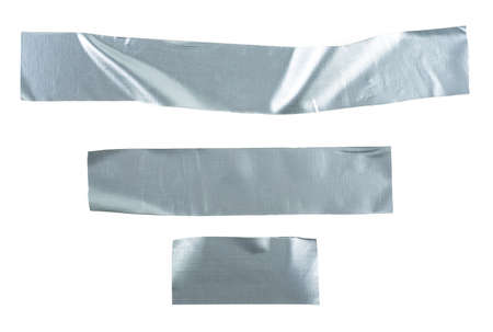 Set pieces of silver self-adhesive construction tape isolated on a white background. Metallic reinforced tape.の写真素材