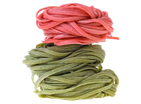 Multicolored pasta isolated on a white background. Pasta tagliatelle.の写真素材