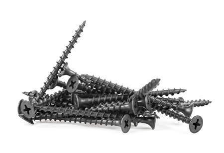 Pile of new black screws isolated on a white backgroundの写真素材