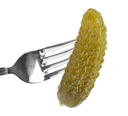 Fork with gherkin isolated on a white background. Pickled cucumber on fork.の写真素材