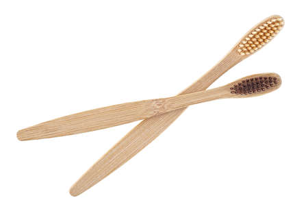 Two eco-friendly bamboo toothbrushes isolated on a white background, top view. Wooden toothbrushes.の写真素材