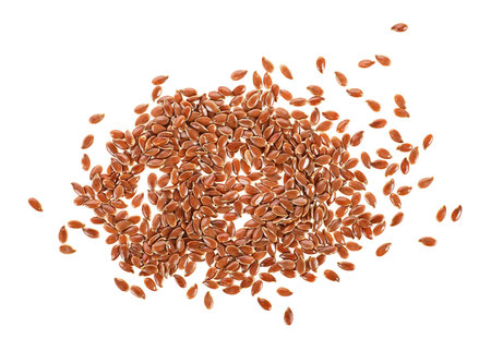 Brown flax seeds isolated on a white background. Top view.の写真素材