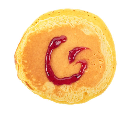 Freshly baked pancake with raspberry jam isolated on white background, top view.の写真素材