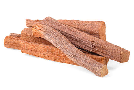 Pile of sandalwood sticks isolated on a white background. Chandan or sandalwood. Perfume.の写真素材