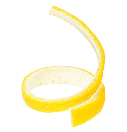 Vertical image of fresh lemon peel, white background. Cocktail ingredient. Lemon twist.の写真素材