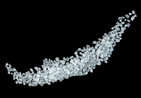 Sea salt on a black background, top view.の写真素材