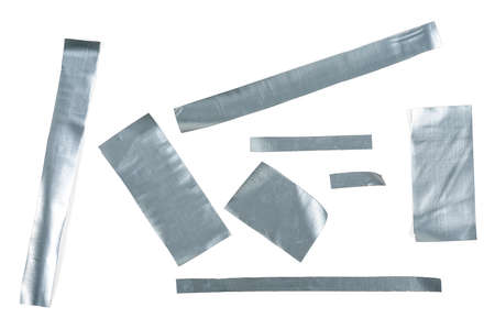 Metallic reinforced tape. Set pieces of silver self adhesive construction tape isolated on a white background.の写真素材