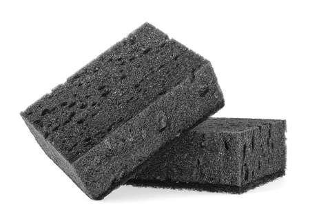 Two new absorbent black sponge isolated on a white background. Black kitchen sponges.の写真素材