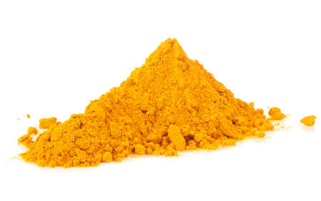 Dry turmeric powder isolated on a white background. Pile of curcuma powder.の写真素材