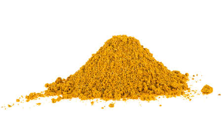 Pile of powdered yellow curry spice isolated on a white backgroundの写真素材