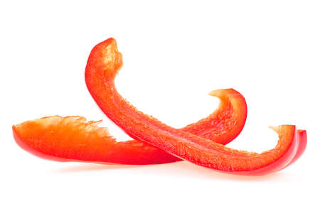 Red sweet bell pepper sliced strips isolated on a white background. Fresh paprika slices.の写真素材