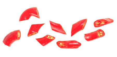 Red chopped chili peppers isolated on a white background, top view. Red chili slices.の写真素材