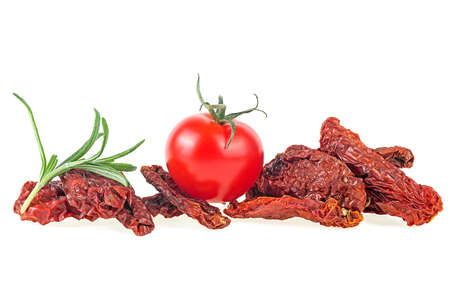 Mediterranean cuisine - sun dried tomatoes with fresh tomato and rosemary isolated on a white background. Vegetarian concept.の写真素材