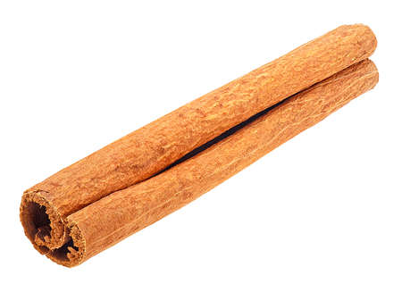 Single cinnamon stick isolated on a white background. Cinnamon bark.の写真素材