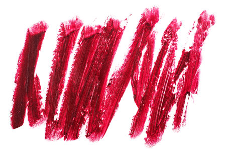 Red lipstick stroke isolated on a white background, top view.の写真素材