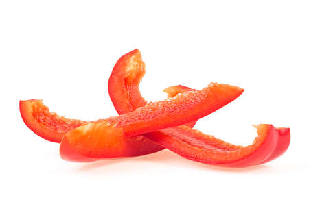 Slices of red sweet bell pepper isolated on a white background, front view. Fresh Bulgarian pepper.の写真素材
