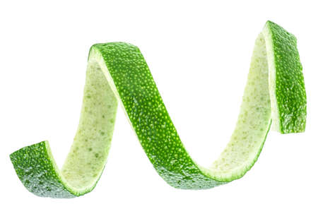 Lime zest isolated on a white background. Healthy food. Cocktail ingredient.の写真素材