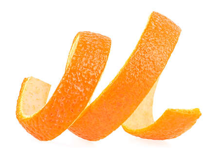 Curly orange zest isolated on a white background. Spiral orange peel.の写真素材