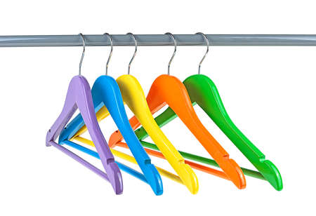 Store concept - Wooden colored hangers on a rod isolated on white background. Empty hangers.の写真素材