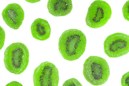 Dried kiwi fruit slices isolated on a white background, top view.の写真素材