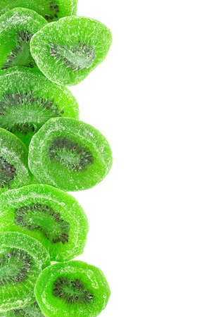 Dried kiwi fruit slices isolated on a white background, top view.の写真素材