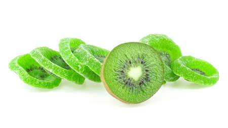 Slices of dried kiwi and fresh kiwi fruit isolated on a white background. Dried candied kiwi fruit slices.の写真素材