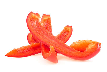 Slices of red sweet bell pepper isolated on a white background. Red pepper slices strips.の写真素材