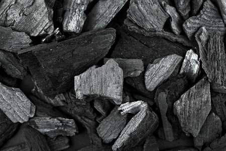 Black charcoal texture as background, top view. Close-up.の写真素材