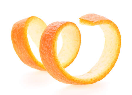 Orange spiral zest isolated on a white background, orange peel.の写真素材