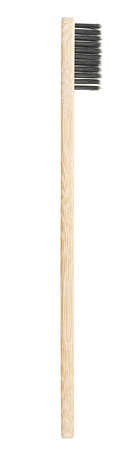 Bamboo toothbrush isolated on a white background, top view. Eco-friendly bamboo toothbrush with black nylon bristles.の写真素材
