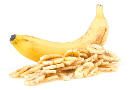 Dried banana slices and fresh banana isolated on a white background. Banana dessert. Healthy Food.の写真素材