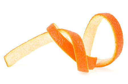 Single orange peel isolated on a white background. Vitamin C, skin health beauty concept.の写真素材