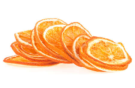 Pile of dried orange slices isolated on a white background. Orange chips.の写真素材