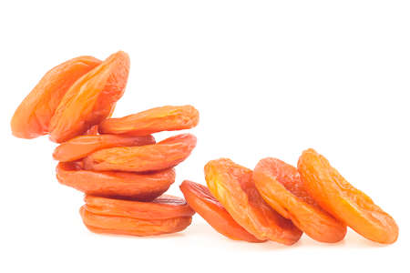 Heap of dried apricots fruit isolated on a white background, front view.の写真素材