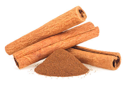 Stick of aromatic cinnamon with powder isolated on a white background, front view.の写真素材