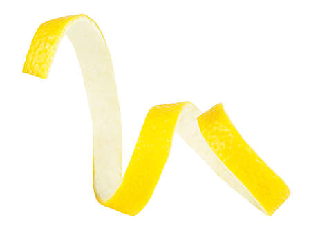 Ripe lemon twist isolated on a white background. Lemon peel as cocktail ingredient. Healthy food.の写真素材