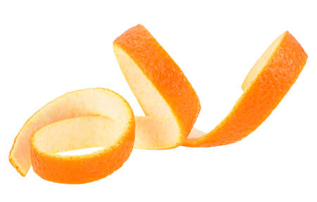 Aromatic orange zest isolated on a white background. Fresh spiral orange twist.の写真素材