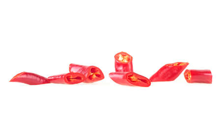 Front view of red chopped chili peppers isolated on a white background.の写真素材