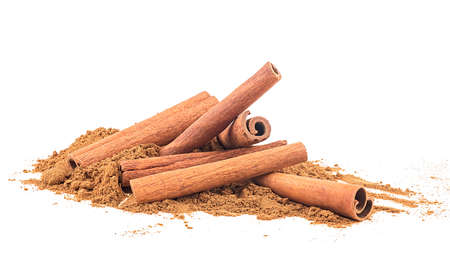 Cinnamon sticks and cinnamon powder isolated on a white background. Aromatic cinnamon sticks.の写真素材