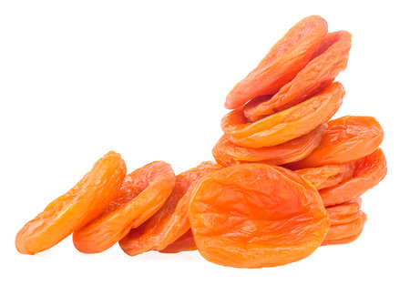 Heap of dried apricots isolated on a white background. Dry apricot fruits.の写真素材