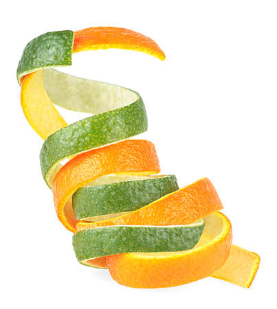 Orange and lime fruit peel isolated on a white background. Fresh citrus fruit skin.の写真素材