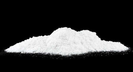 Pile of snow on a black background. Snow hills. Pile of snow crystals.の写真素材